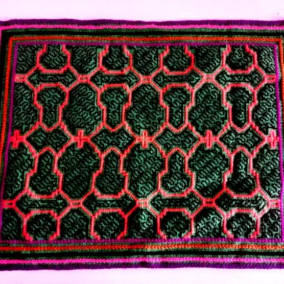 Hand embroidered shipibo altar design multicolored patterns Amazon jungle